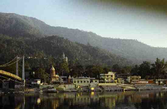 Lakshman Juhla spans the Ganges to the famous Swargashram. White peaked building in background is the Kailashanand Mission.